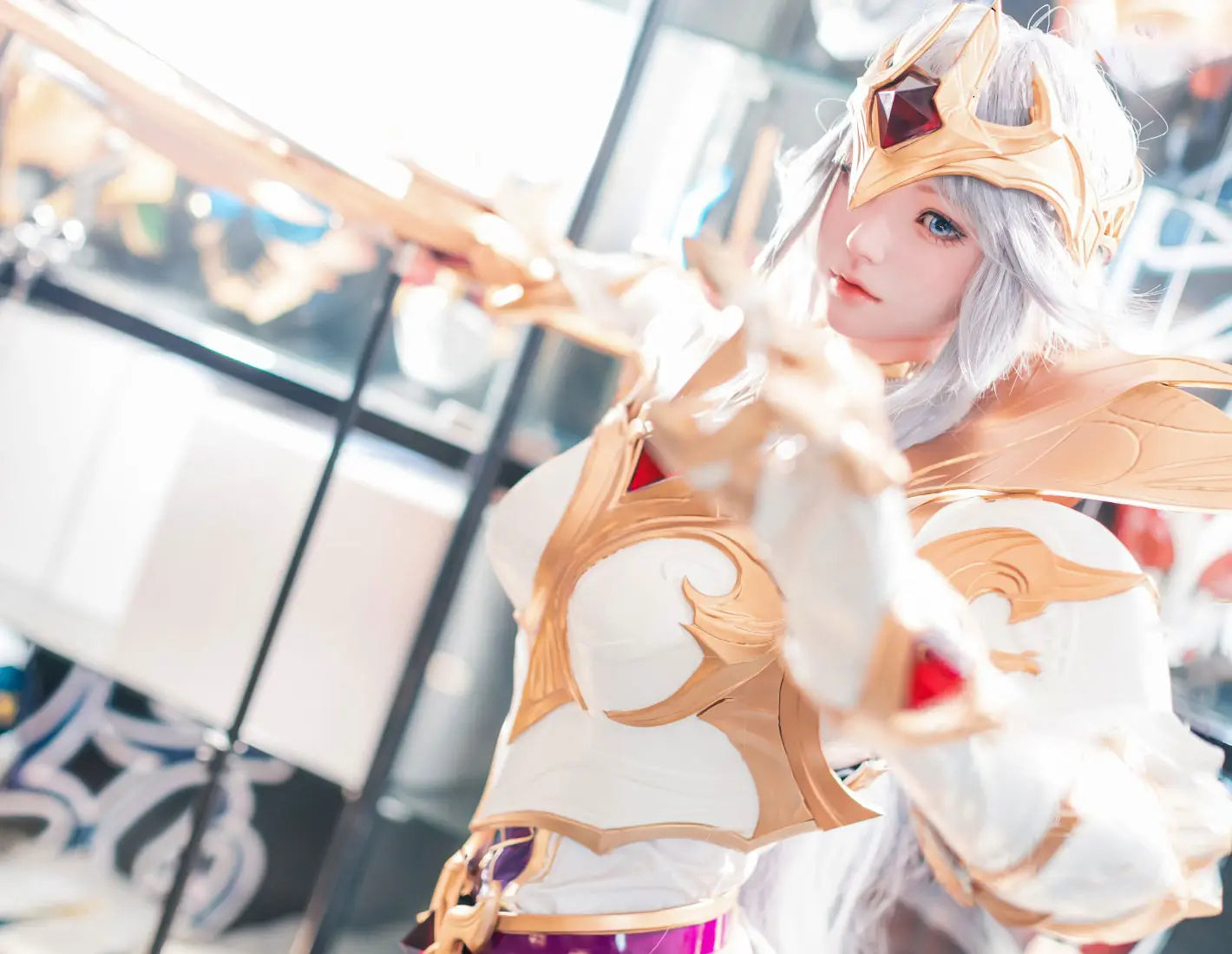 Alena, silver-white long hair, gold ruby crescent crown, white gold imperial armor, blue gold skirt, Diana Lunar Goddess Prestige Emperor skin, high-contrast filter, looking at the camra, pointing her finger at the camera, battle mode, big sword is coming at the camera direction– League of Legends cosplay fantasy sex doll by TopLoveDoll