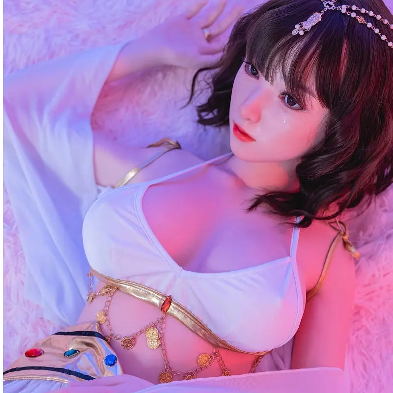 Allison, black short curly hair, hair jewelry, belly dance costume, purple light scenario, lying on a fur carpet, bust shot, mysterious vibes, topless– oriental belly dance Asian companion sex doll by TopLoveDoll