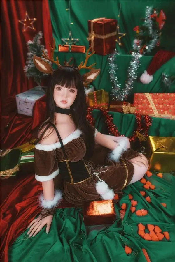 Amaris long black straight hair blunt bangs antler headband brown velvet top, Asian school goddess face Christmas red green background, cute asian girlfriend, sitting among the gifts pile under Christmas tree, looking into the camera, doe-eye stare – deer girl cosplay sex doll by TopLoveDoll
