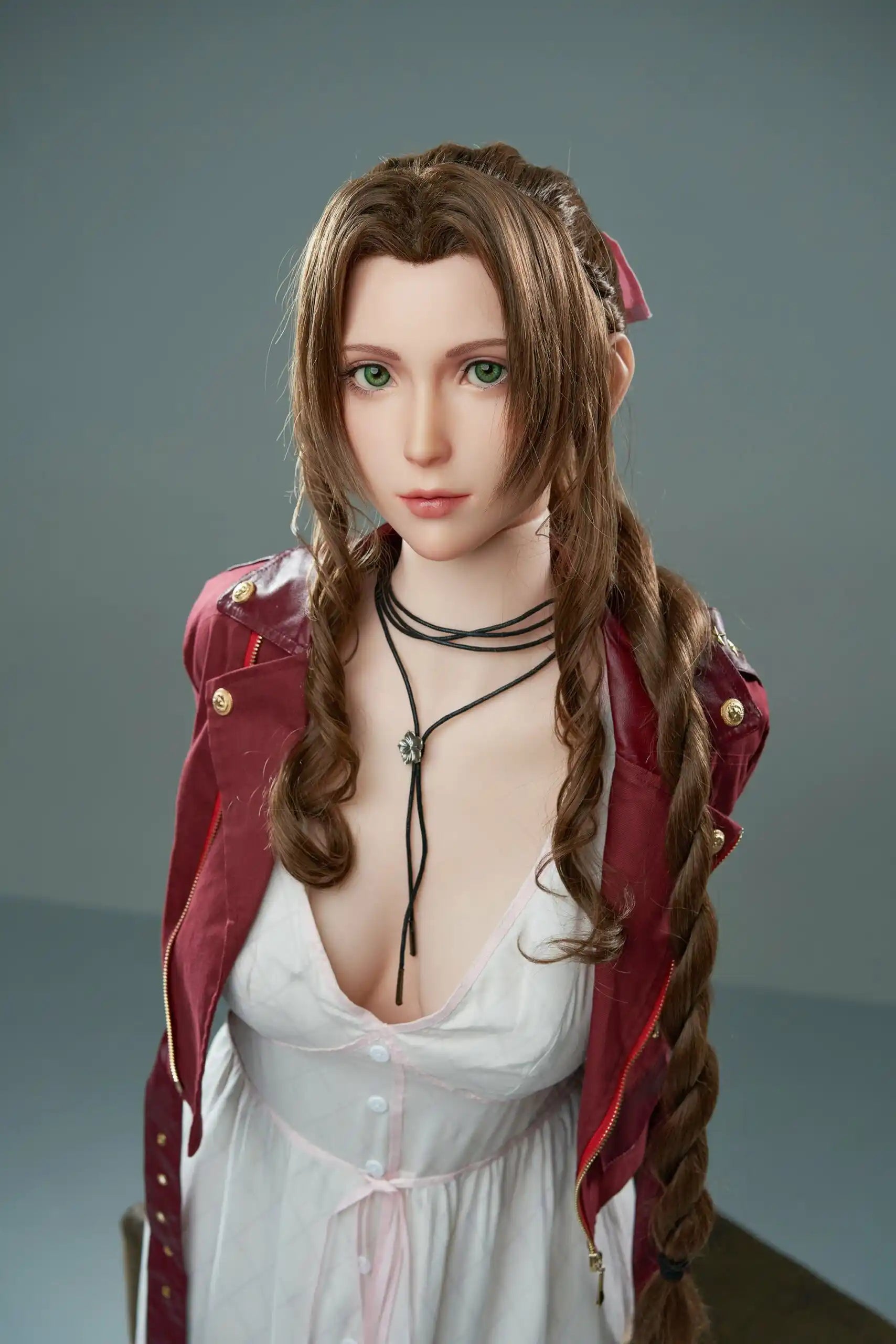 Seyo, brown wavy twin braids, pink hair bow, burgundy leather jacket, white deep-V slip dress, black leather mid-calf boots, green eyes, layered leather string choker, golden layered bracelet, looking at the camera like curious, grey studio background – Tifa Lockhart cosplay sex doll by TopLoveDoll