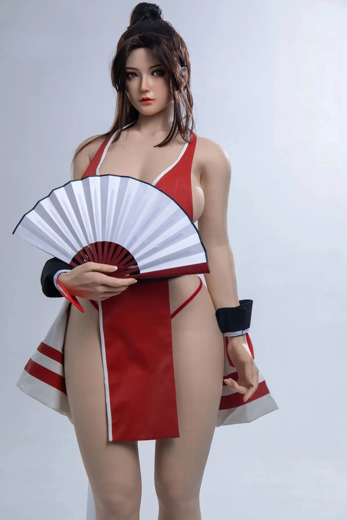 Aileen, long black hair, high ponytail with half-down hair, standing, holding her signature weapon, the fan, in her hand,  red Mai Shiranui signature kunoichi costume, sex AF– cosplay sex doll by TopLoveDoll