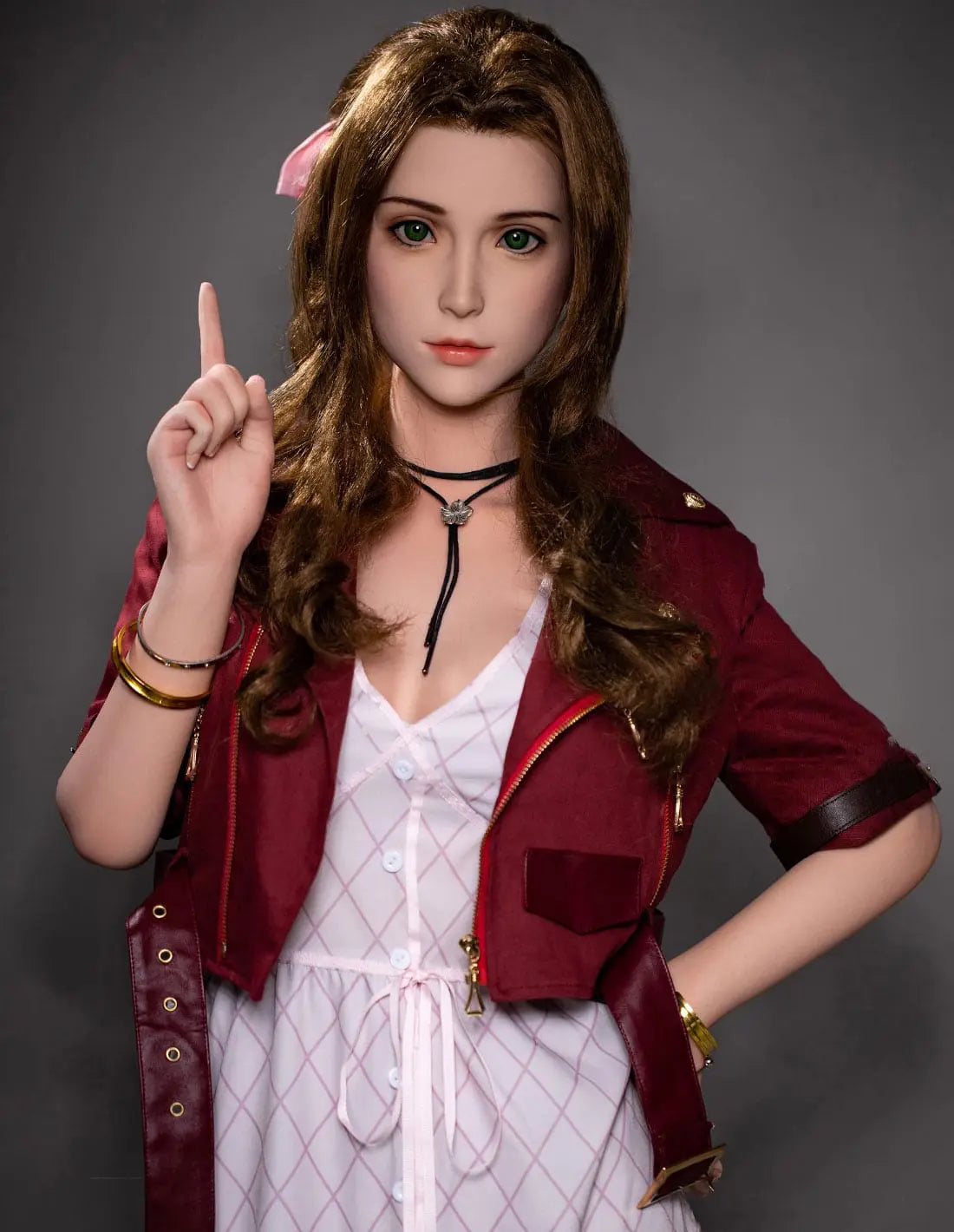 Hera, dark brown long curls hair, dark red suede jacket, white V-neck slip dress, pink bow, black choker, grey studio lighting background, pointing one figure up, the other hand on the waist, looking at the camera – European bookish bombshell companion sex doll by TopLovedoll