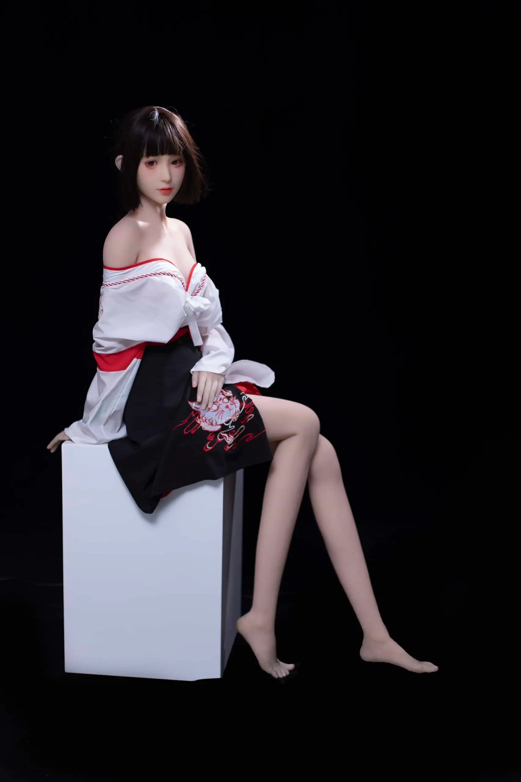 Ethereal maiden, Aleena, black princess cut half-up hair, wind blowing up her hair, white miko top, red hakama floral folding fan, dark shrine backdrop, backlit shot, sitting on a white object, side view, her clothes slip off shoulders to the chest level, showing some beautiful curves– Japanese miko shrine maiden companion sex doll by TopLoveDoll