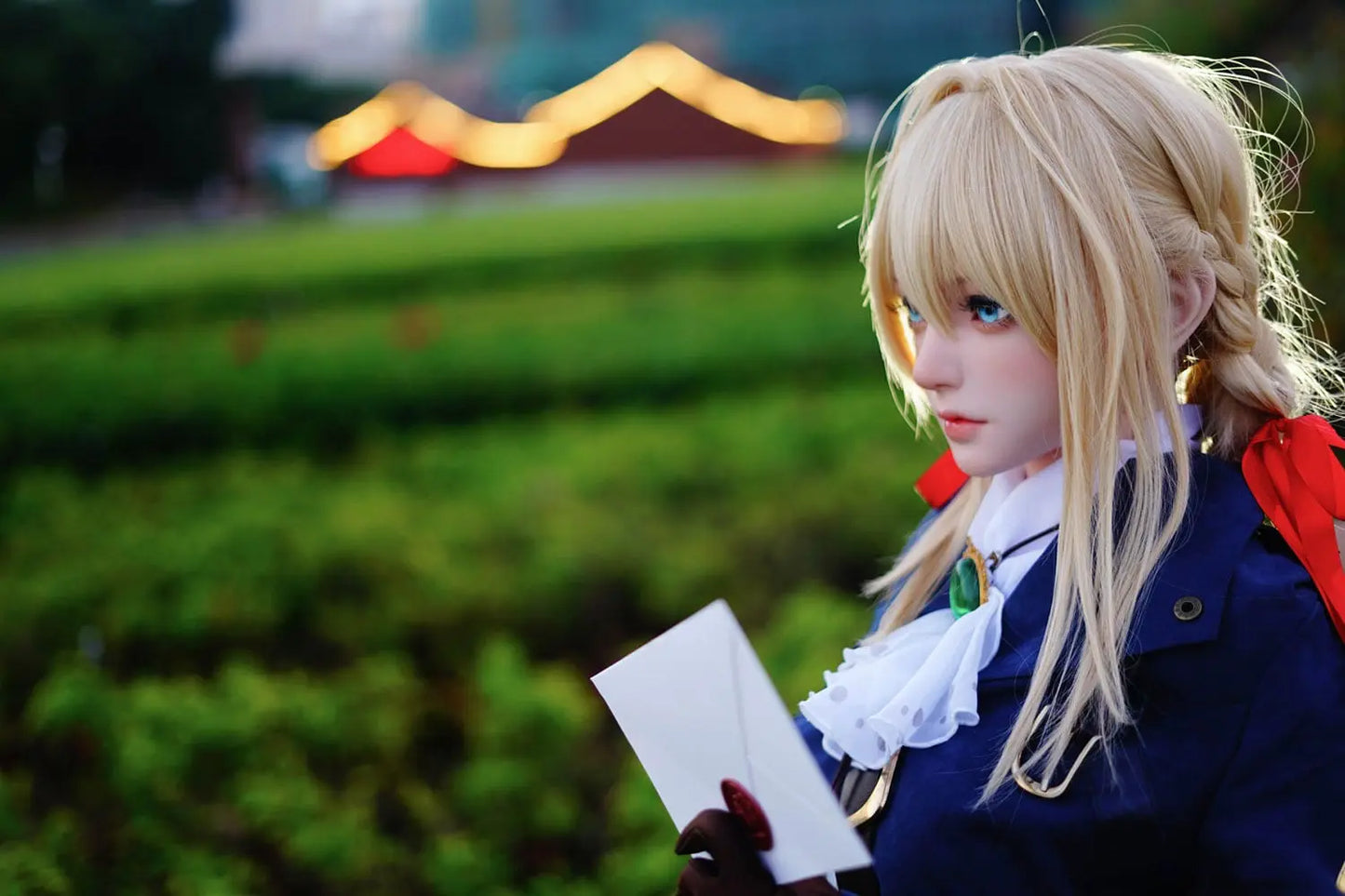 Aliana, golden straight long hair, blue eyes, navy Auto Memory Doll uniform, white apron, black leather boots, outdoor, standing, holding an envelop, brown gloves, holding a brown leather suitcase, eye-level shot, 45-degree side view, look away, doing the salute gesture, horizontal profile – Violet Evergarden cosplay anime sex doll by TopLoveDoll