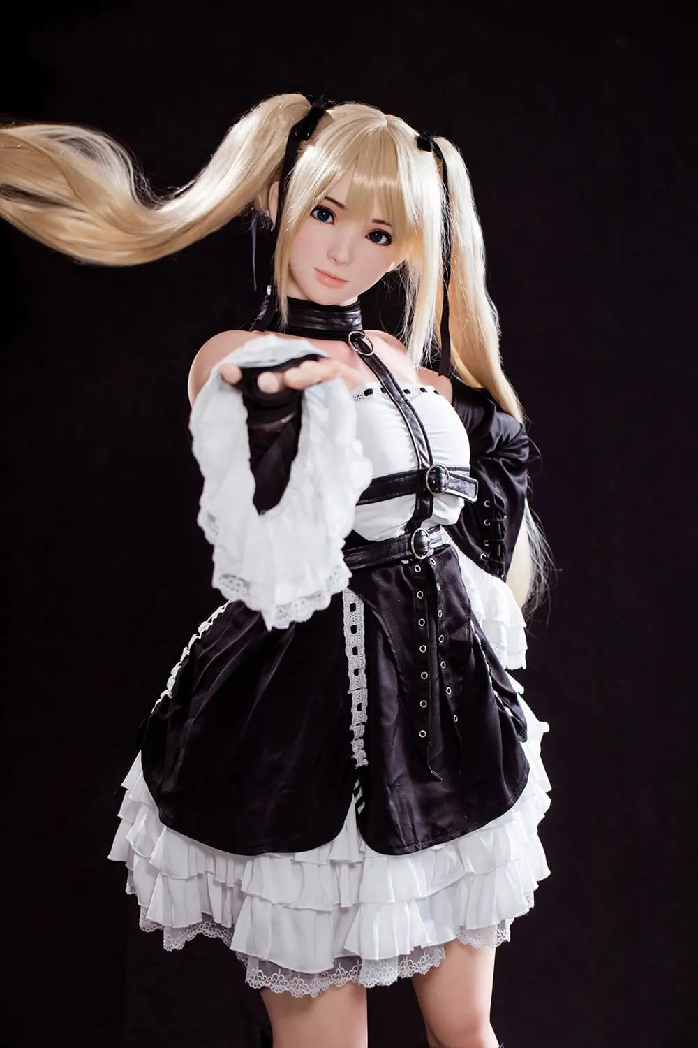 Alison blonde twin tails, black and white maid outfit, cosplay pose, dark background, standing and pointing her fingers up, slightly further profile view – Marie Rose cosplay sex doll by TopLoveDoll