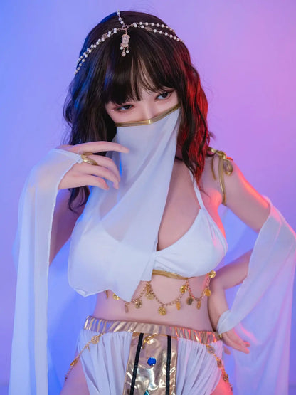 Allison, black short curly hair, hair jewelry, belly dance costume, purple light scenario, with her veil on, sitting on a white rectangular pillar, close-up – oriental belly dance Asian companion sex doll by TopLoveDoll