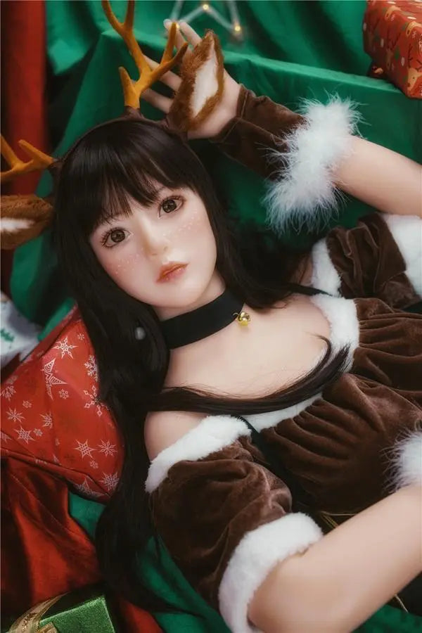 Amaris long black straight hair blunt bangs antler headband brown velvet top, Asian school goddess face Christmas red green background, cute asian girlfriend, lying on the gifts pile under Christmas tree – deer girl cosplay sex doll by TopLoveDoll