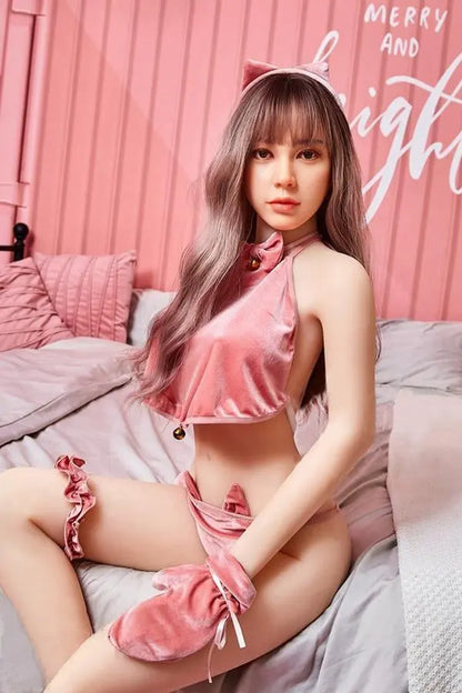 Amelia long wavy brown hair pink crop top pink mini skirt Y2K sweetgirl sitting in pink room soft Asian companion, sitting on a pink chair wearing pink lingerie set, sitting on bed – girl-next-door sex doll by TopLoveDoll