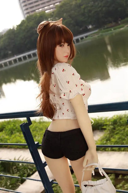 Arya high-maintenance Asian girlfriend sex doll- in cherry crop top and black denim shorts , leaning on the fencers at the river bank- sweet face impossible energy the one you can't quit by TopLoveDoll