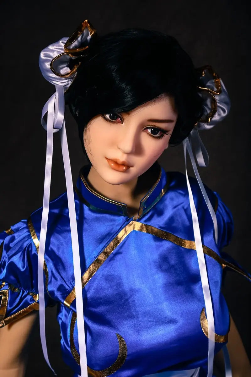 Aubriella Street Fighter Chun-Li cosplay sex doll in blue qipao on a black background, close up - iconic blue qipao fighter fantasy by TopLoveDoll