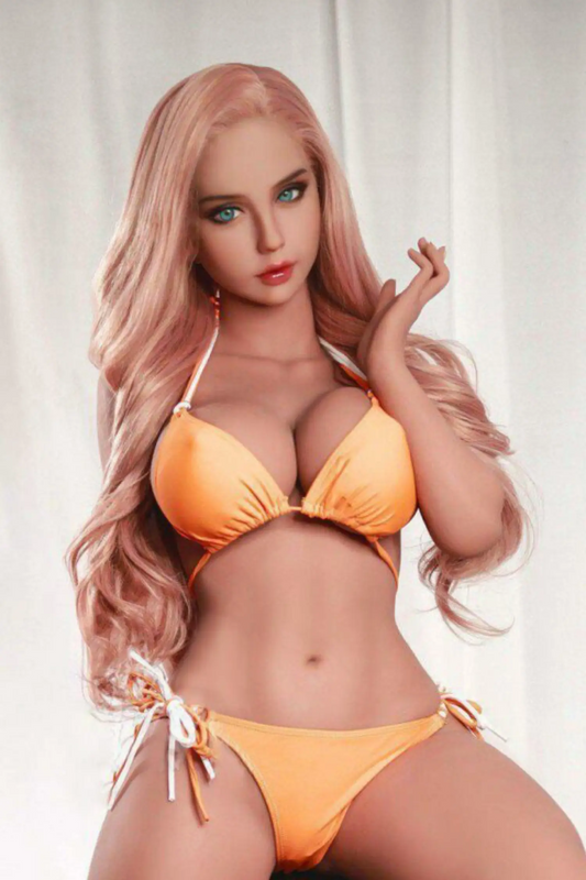 Allura sex doll cool confident stare, green eyes, long wavy strawberry blonde hair, orange halter triangle bikini top over full heavy breasts, matching orange tie-side bikini bottoms, white open peep-toe heels, seated on black leather bar stool with one leg raised, warm beige studio background – full-body seated shot – lifelike European blonde curvy sex doll by TopLoveDoll
