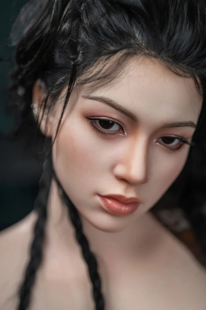 Lifelike Eastern Asian beauty with long black braided hair, wearing black tube top and skirt, standing confidently at zebra-patterned throw – realistic companion doll at toplovedoll.com